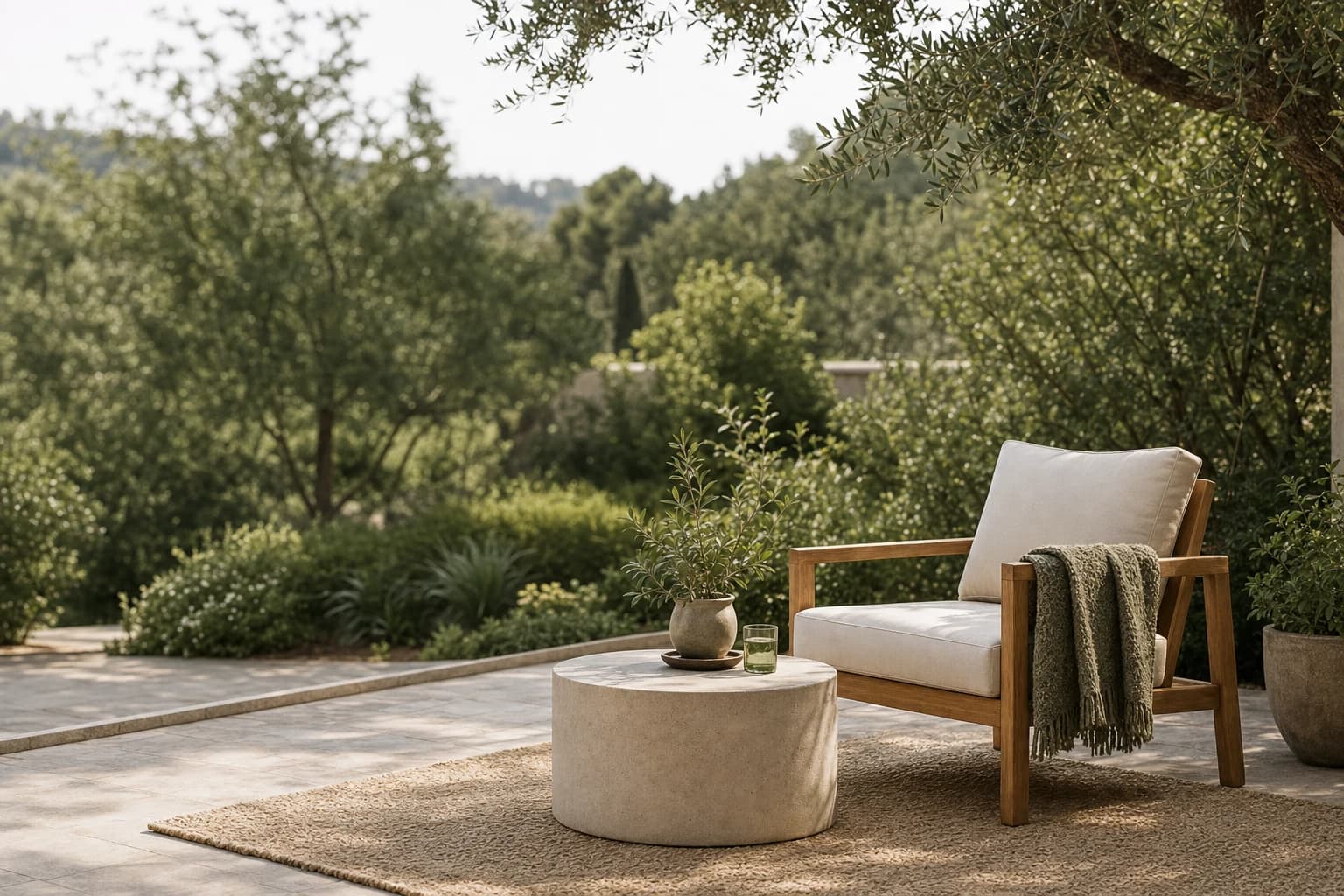 A calm outdoor lounge with a timber chair and stone table among mature garden foliage